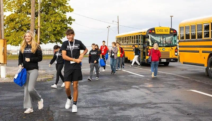 Students walking from buses to MakerFest